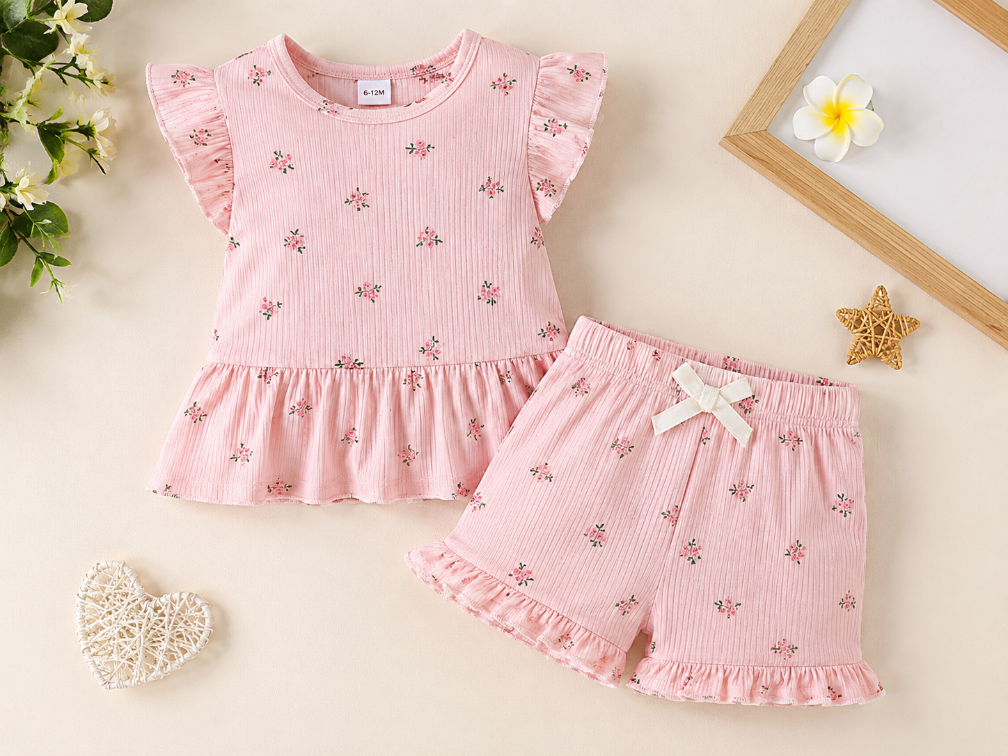 Pastel baby outfit flat lay